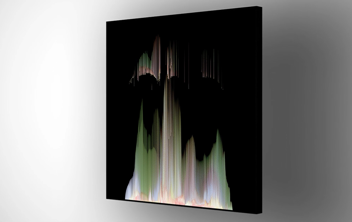 A canvas print hangs on a white wall, featuring abstract digital art with vertical streaks in muted greens, pinks, and whites on a black background, creating a mountain-like silhouette with a glitch effect.